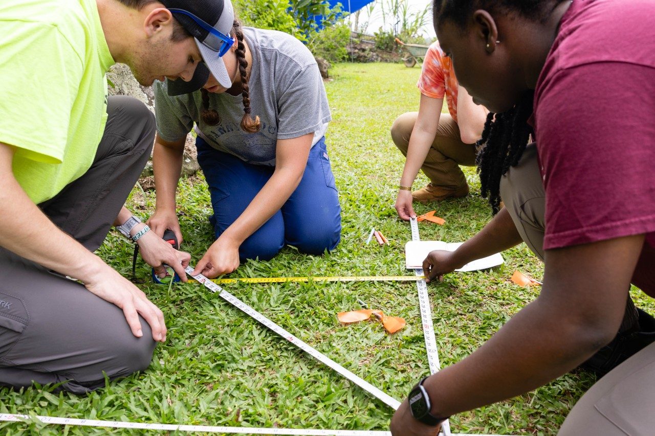 Students plan out playground equipment layout using practical exercises from their classroom time in Blacksburg. Photo by Ashley Williamson for Virginia Tech. 