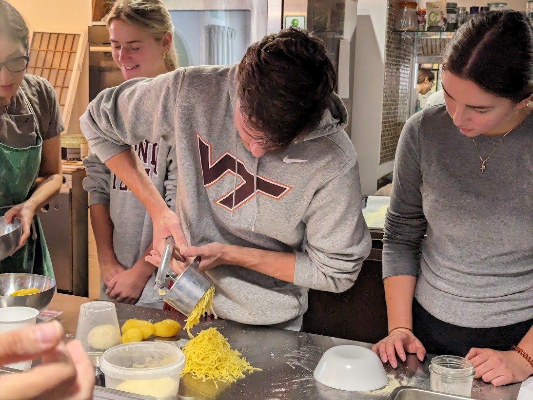 A male student uses a potato ricer.