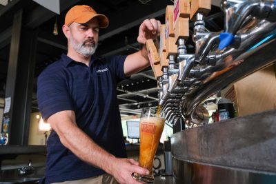 Hardywood Brewmaster Brian Nelson pours a beer from the tap