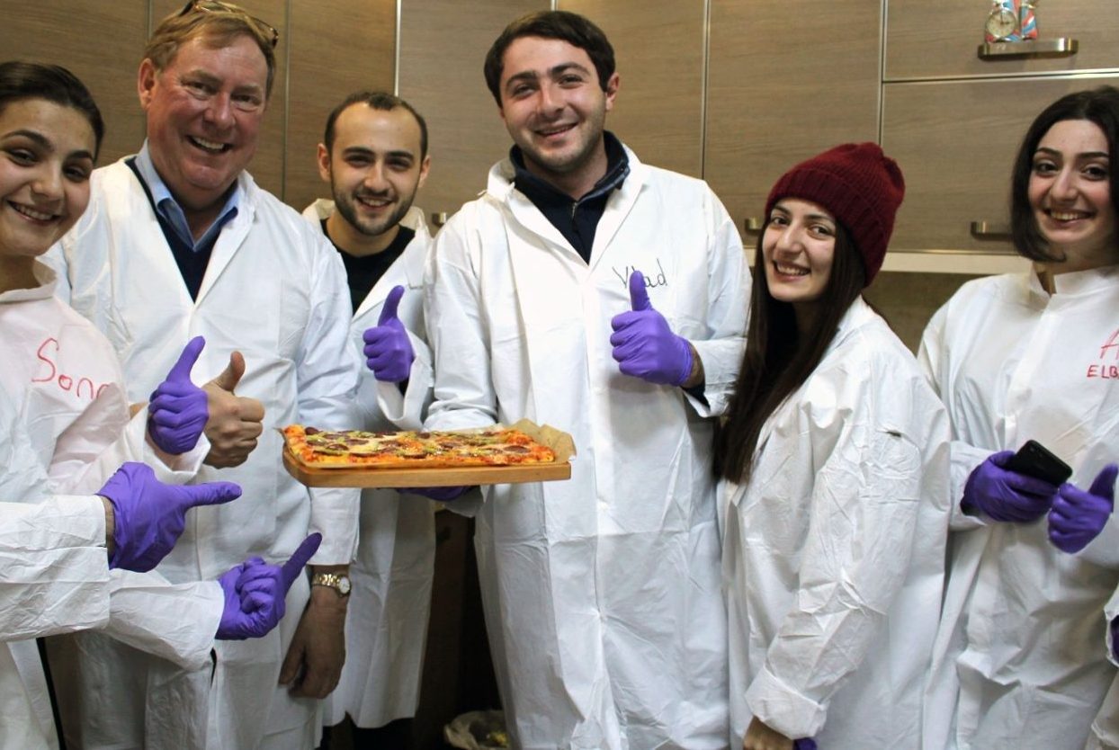 Joe Marcy poses with students at the Armenian National Agrarian University where he piloted a certificate program to teach food safety