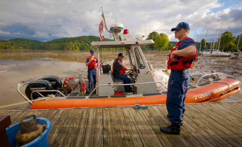 Three men prepare to lauch a Coast Guard boat onto Claytor Lake.