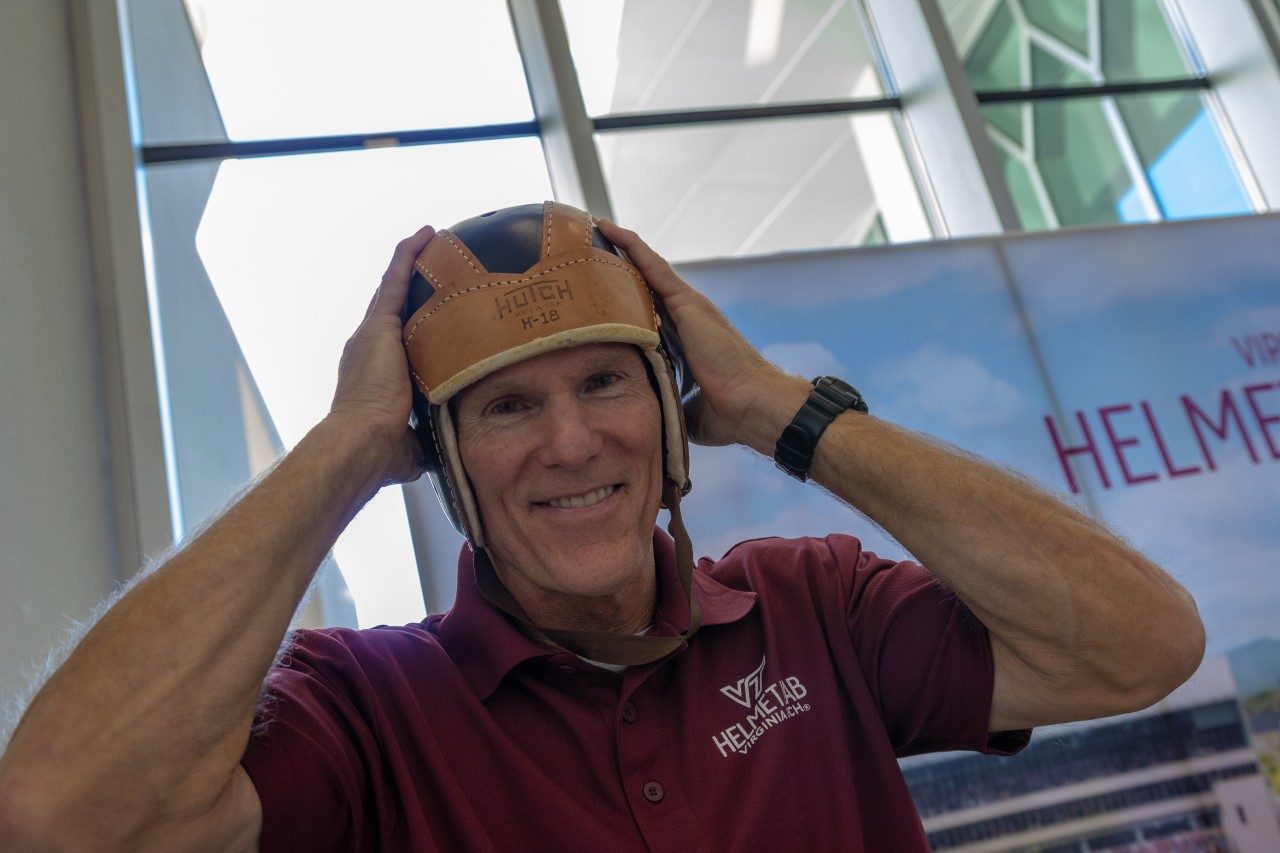 The vintage leather football helmets, also known as leatherheads, were never originally designed for head protection. Instead, they were primarily meant to prevent ear injuries, such as cauliflower ear, which was common during the unregulated early days of football. They did very little to protect players from concussions or skull fractures. Photo by Rodney Kimbangu for Virginia Tech.