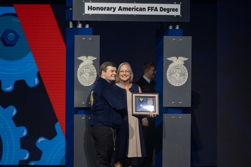 Cathy Sutphin receives her FFA award on stage.