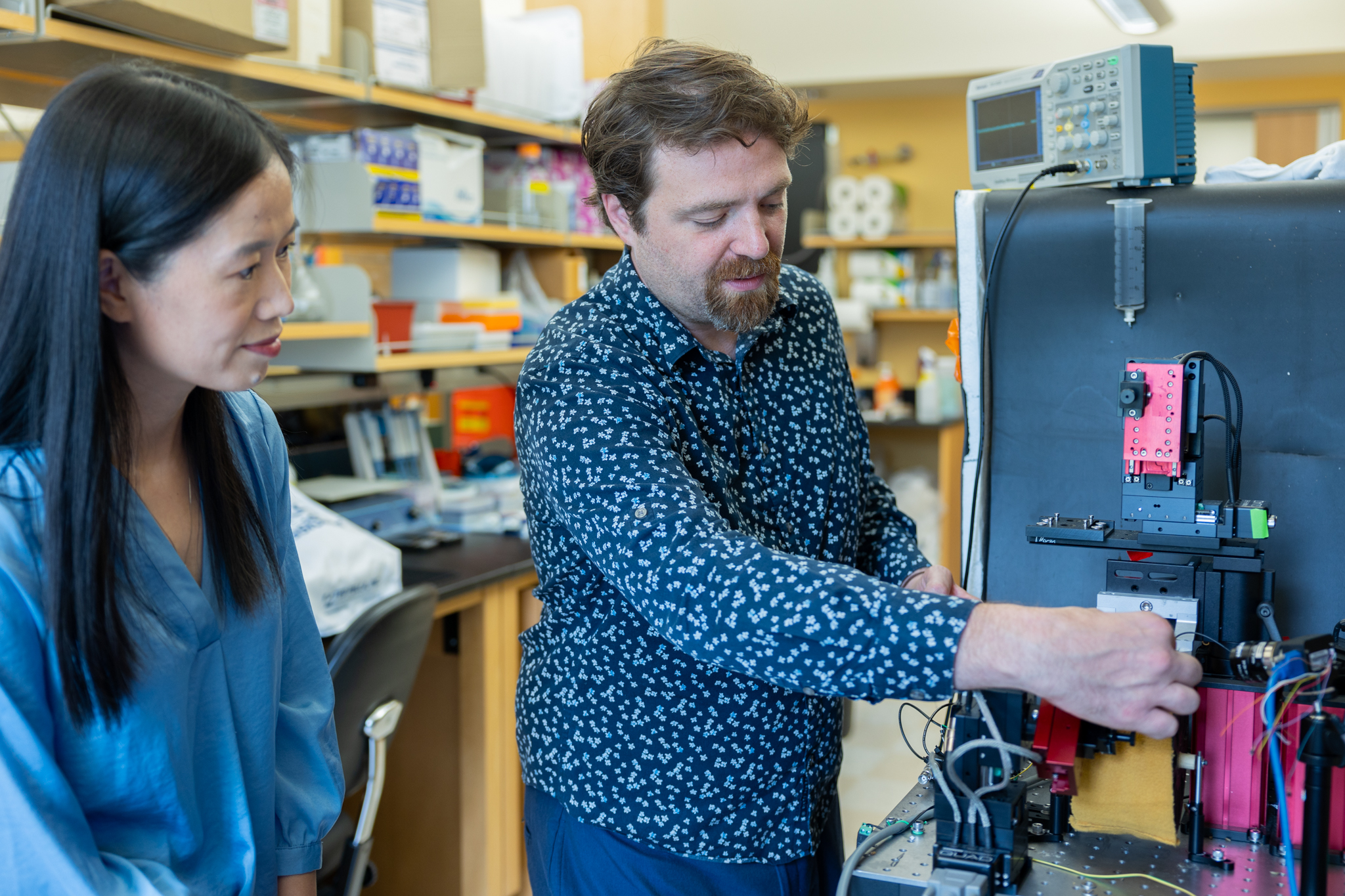 Two Virginia Tech faculty work in the Center for Photonics Lab.