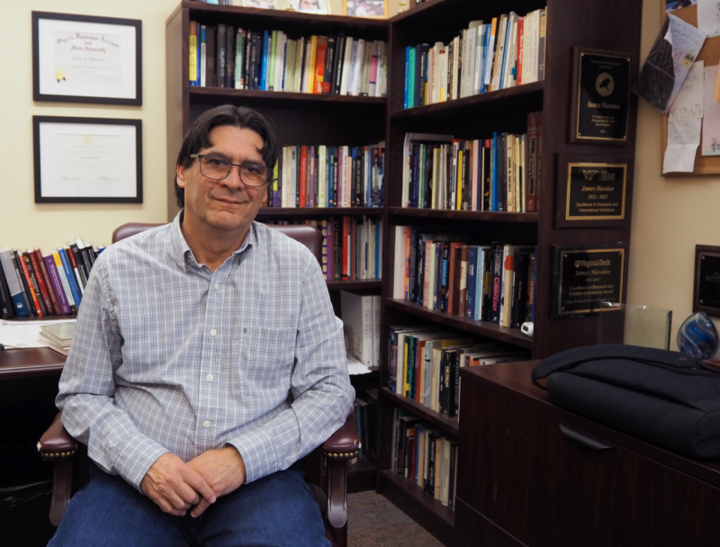 Professor Hawdon sits in his office at the Center for Peace Studies and Violence Prevention.