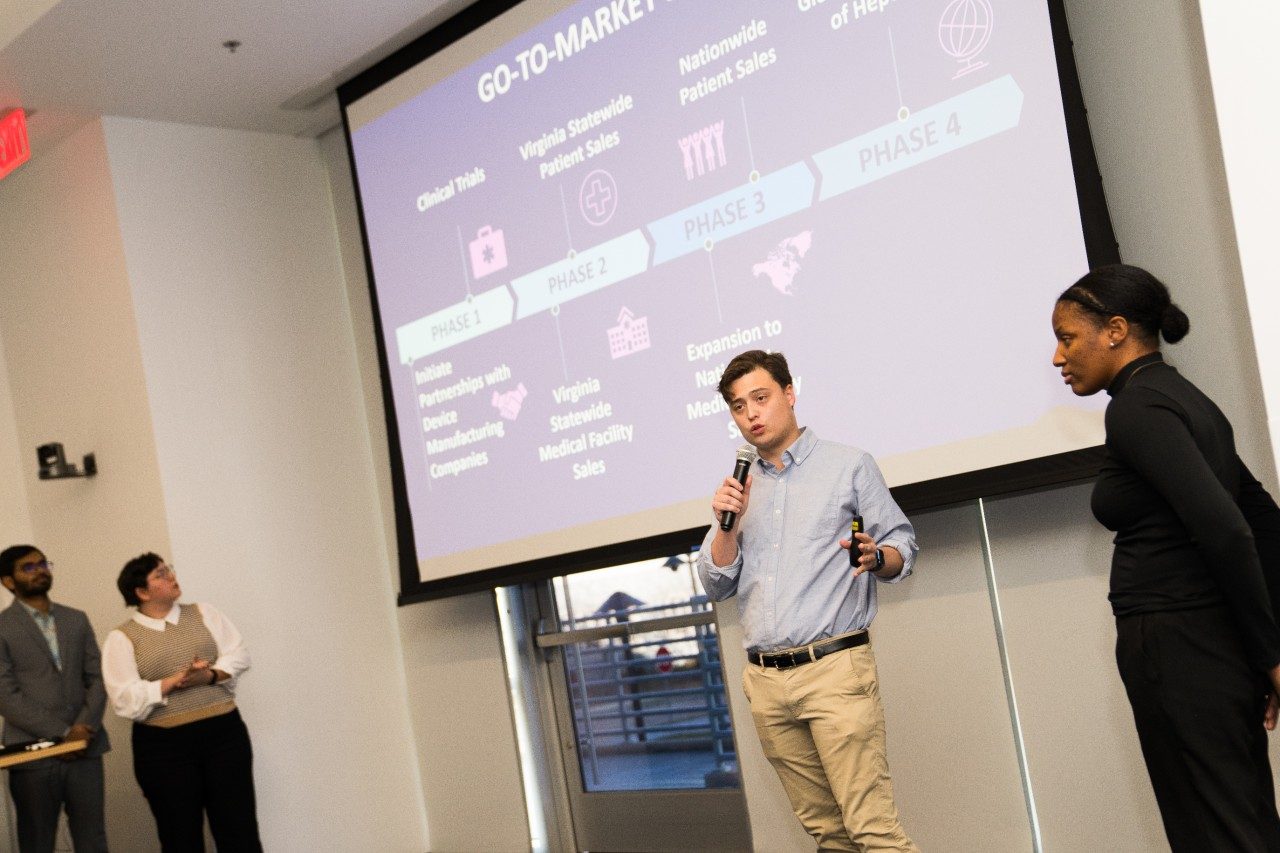 Team members Shakhawat Hossain, Cleo Orlando, Caleb Townsend, and Shaniece Fraser present their startup proposal. 