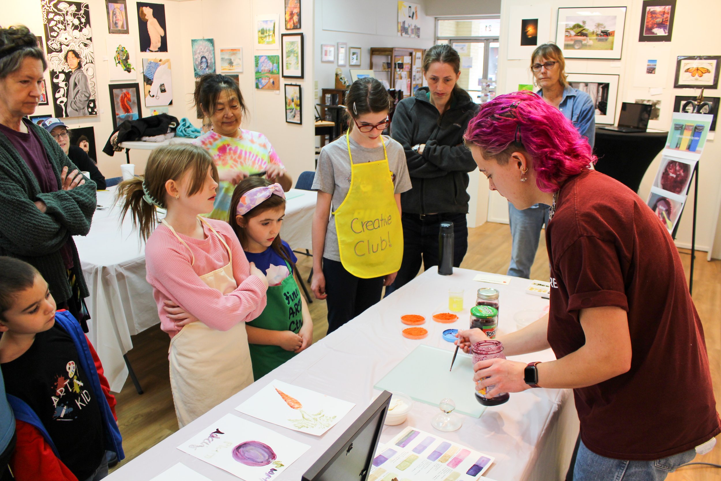 Avery Gendell demonstrates how to use the paint. Photo courtesy of Yoon Choi.