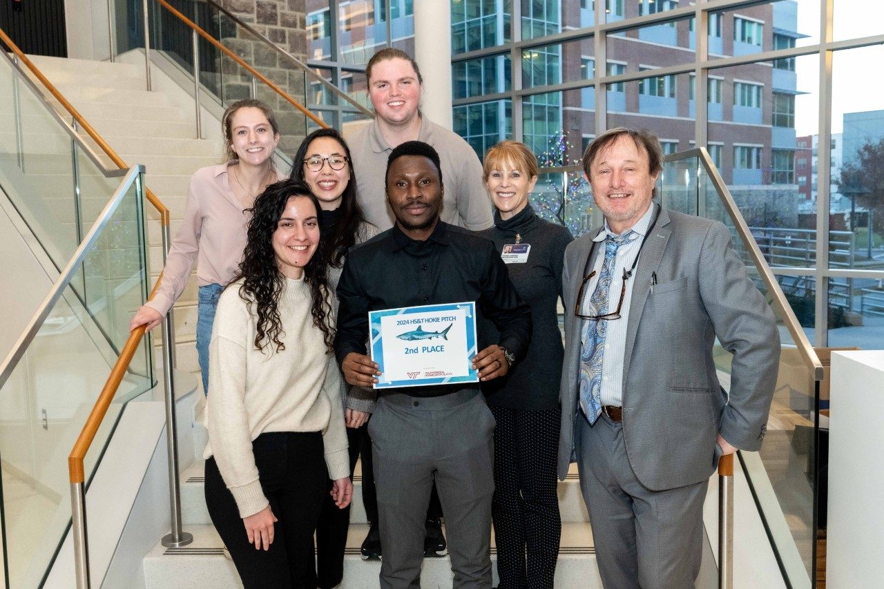 Visor Solutions (second place) aims to revolutionize breast cancer diagnostics with a non-invasive imaging method and software offering real-time results. Front row, from left: Mayd Alsalman, Lateef Anifowose, and Rob Gourdie. Middle row, from left: Peyton Kim-LaTona and team mentor Cynthia Lawrence. Back row, from left: team mentor Mackenzie Woolls and Andy Chitwood. Photo by Clayton Metz for Virginia Tech.