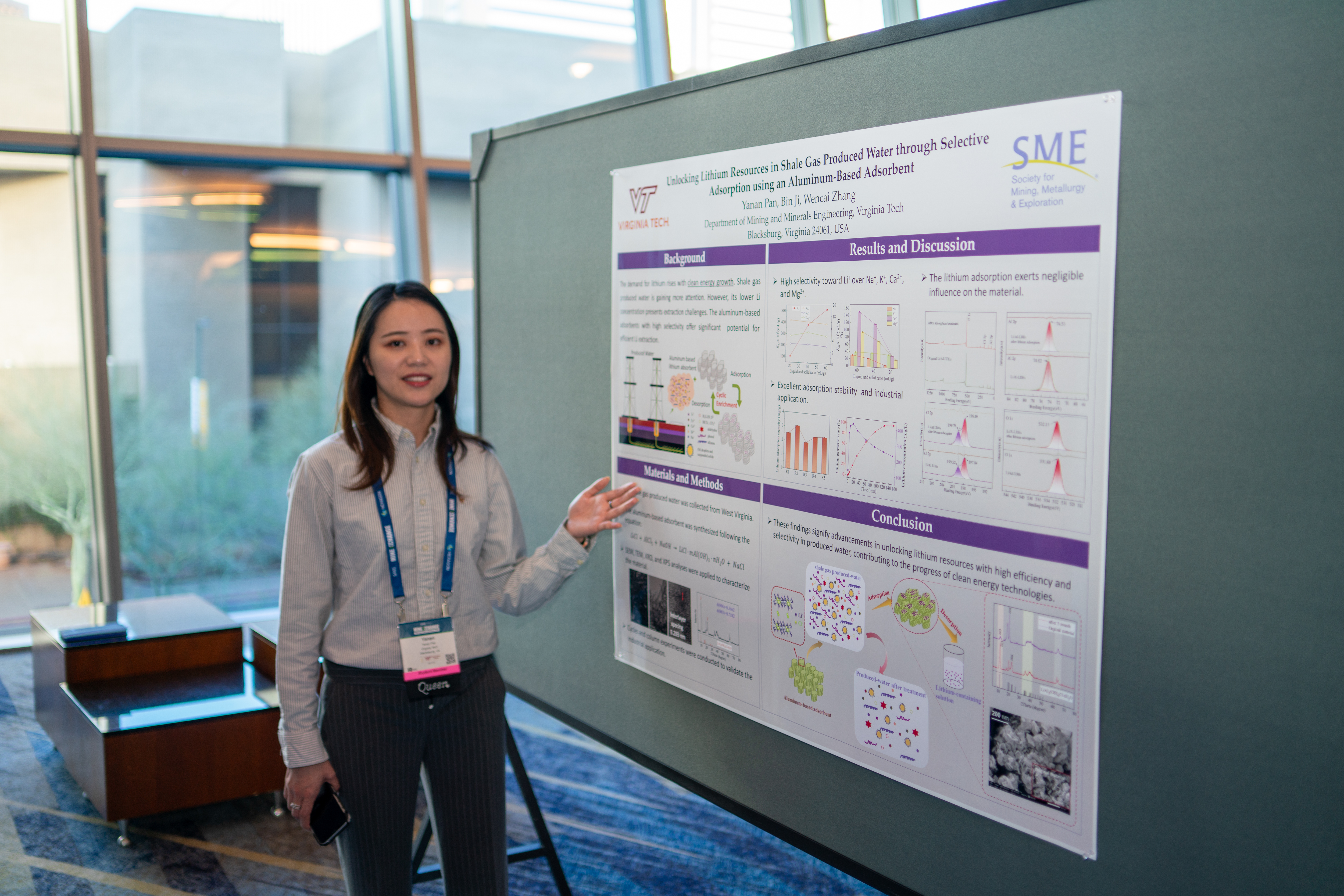 Student Yanan Pan standing in front of her poster.