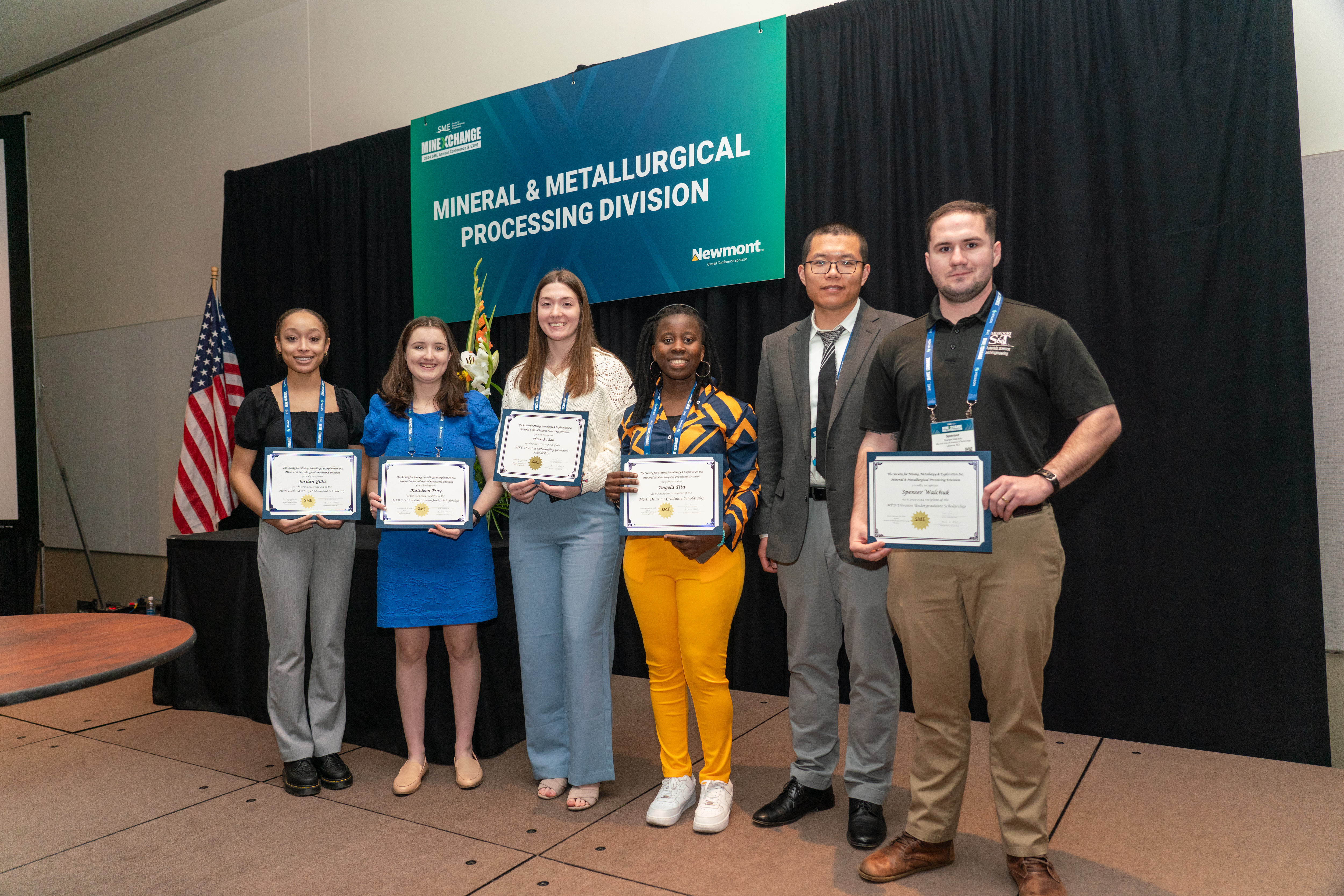 A group of student accepting their scholarship awards.