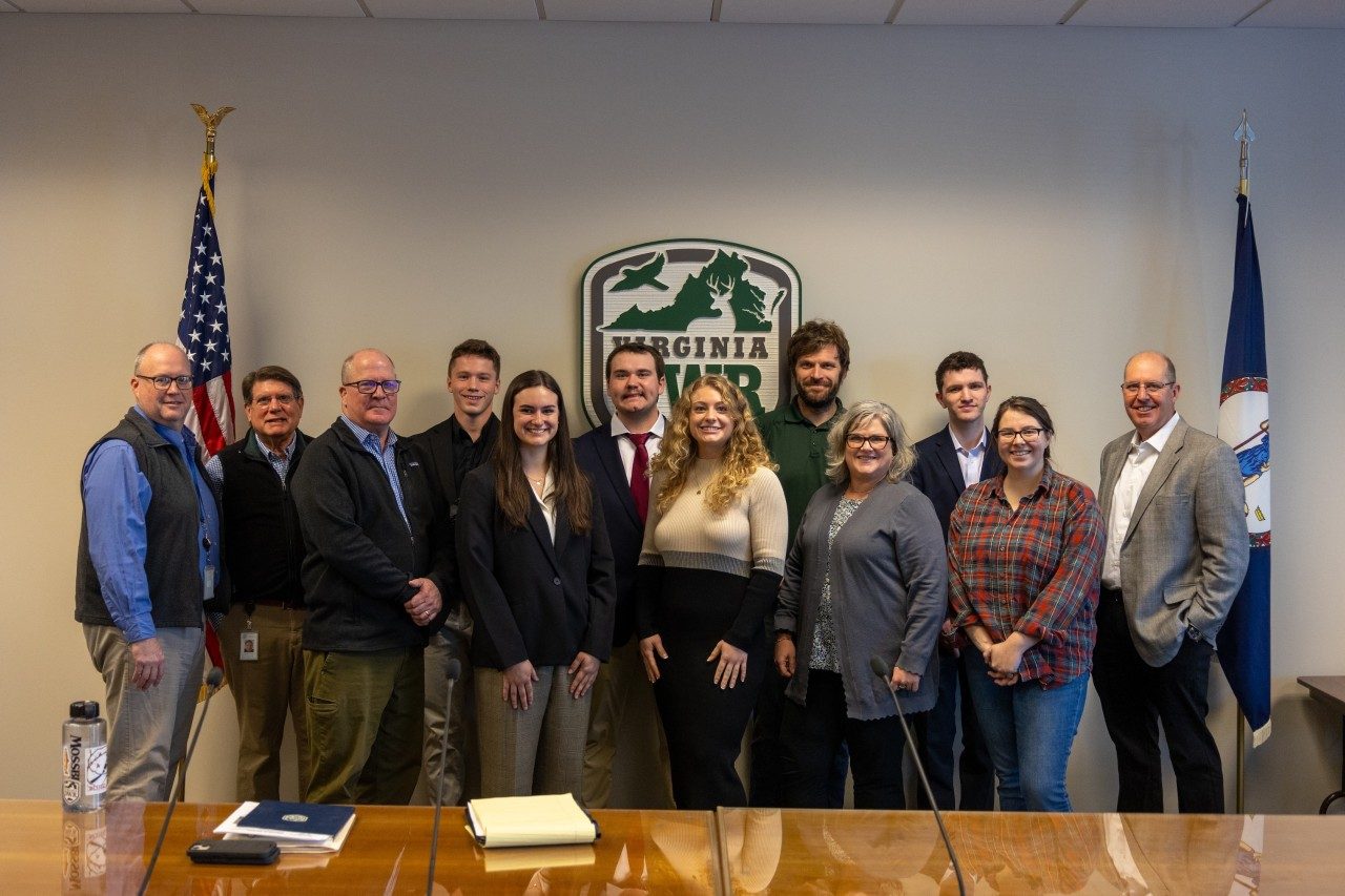 A large group photo of students and working professionals.