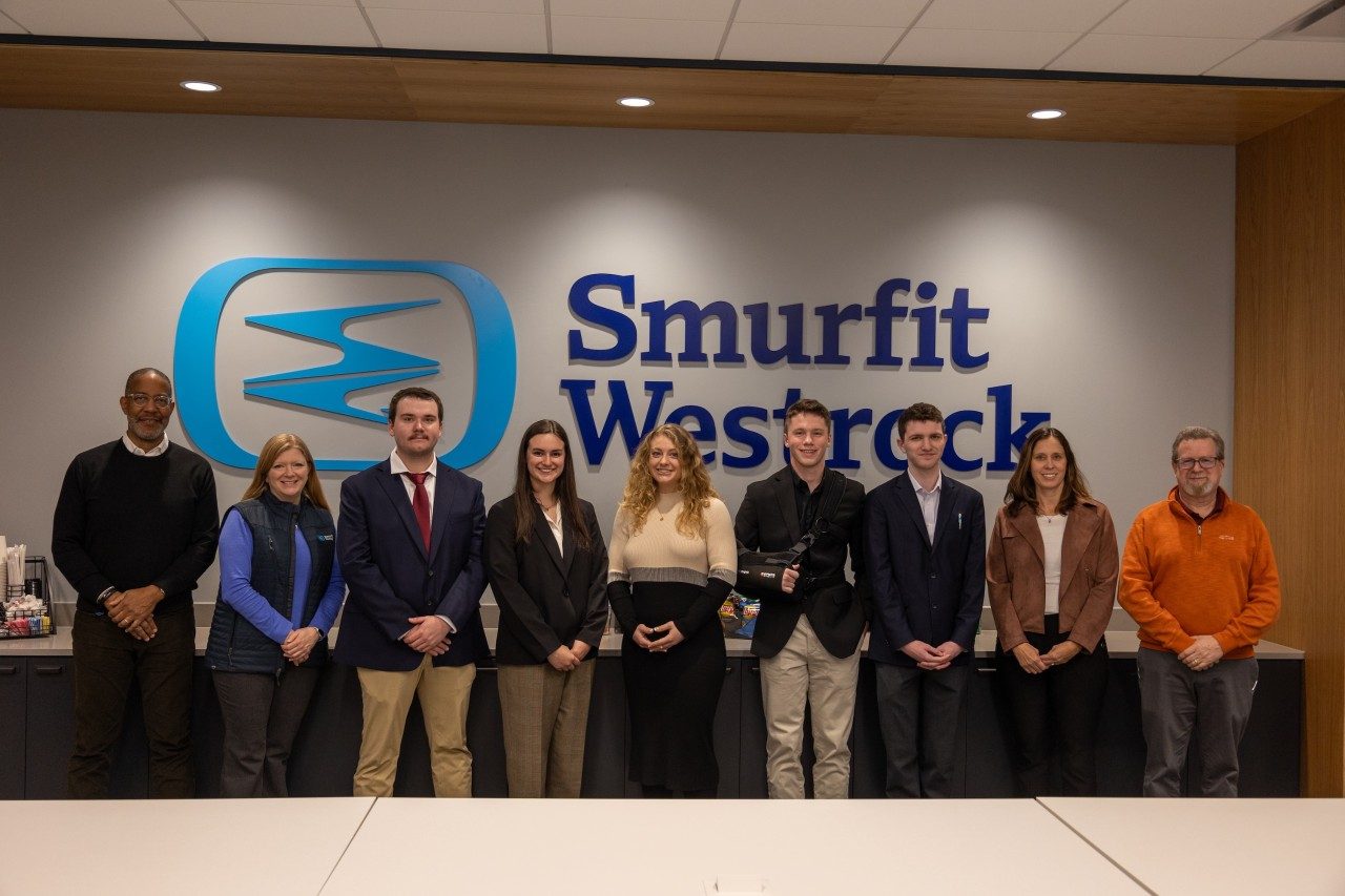 A large group photo of students and working professionals.