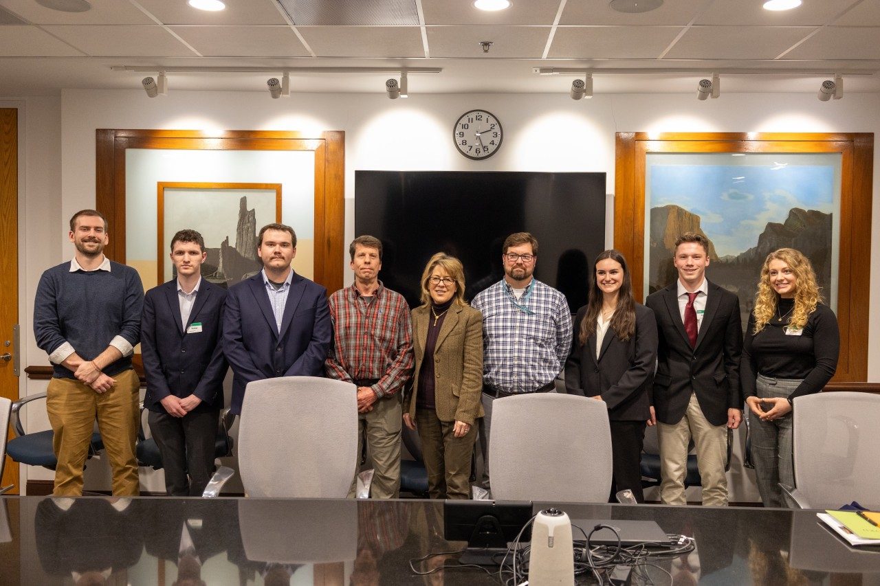 A large group photo of students and working professionals.