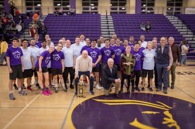 Physicians and students gather around the VTCSOM trophy following the 2025 Docs for Morgan fundraising basketball game.