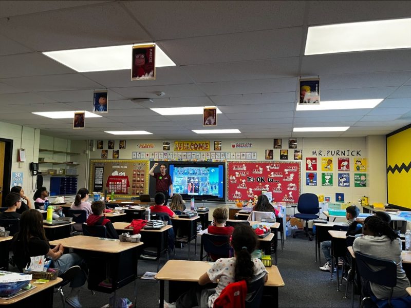 Connor Belt leads a STEM lesson in a fourth grade classroom.