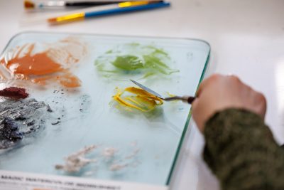 A participant mixes natural pigments during the workshop “Transforming Food Waste into Vibrant Watercolors” in the Expressions Lab at Amazon HQ2. Photo by Craig Newcomb for Virginia Tech.