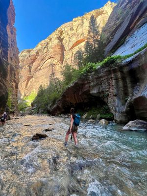 Mary Grace Larson wading through a stream at the Narrows in Zion National Park. Photo courtesy of Mary Grace Larson