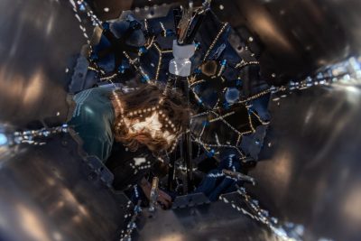 Inside the structure of Emergence, Braden Perryman finalizes internal fastenings. Photo by Trevor Finney for Virginia Tech.