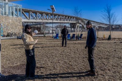 Rude Graves (left), Trevor Finney (center), and Braden Perryman (right) assess the site for Emergence. Photo by Damon Brewer for Virginia Tech.