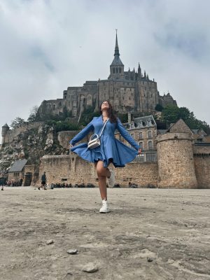 During her study abroad experience, Karla Garibay poses in front of Mont Saint-Michel in France