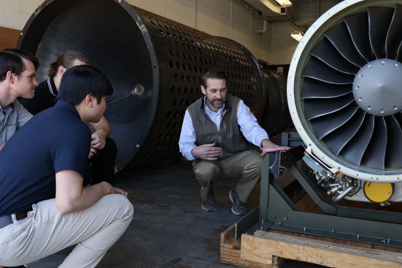 Todd Lowe showing students new PW308A engine. 