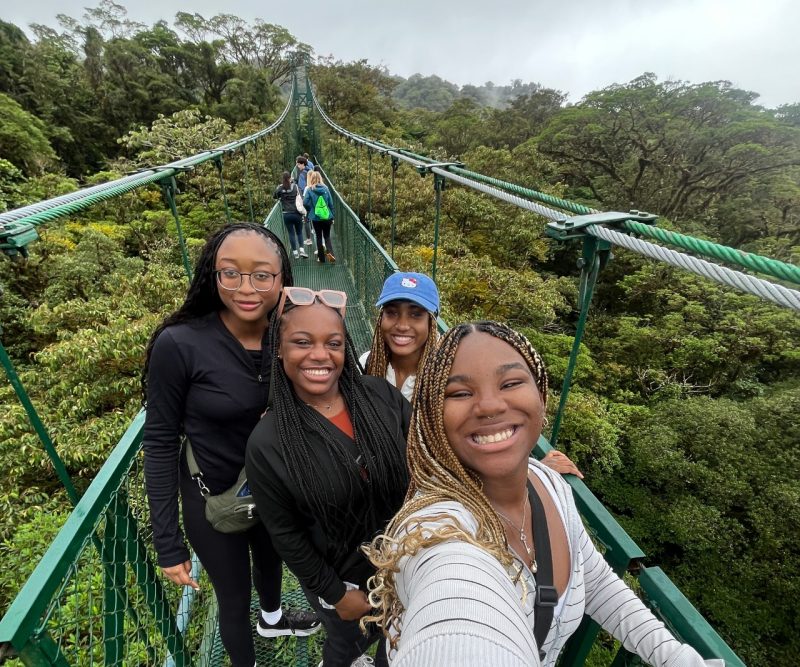 Nakyah Vaughan (at right) on a bridge with friends in Costa Rica.