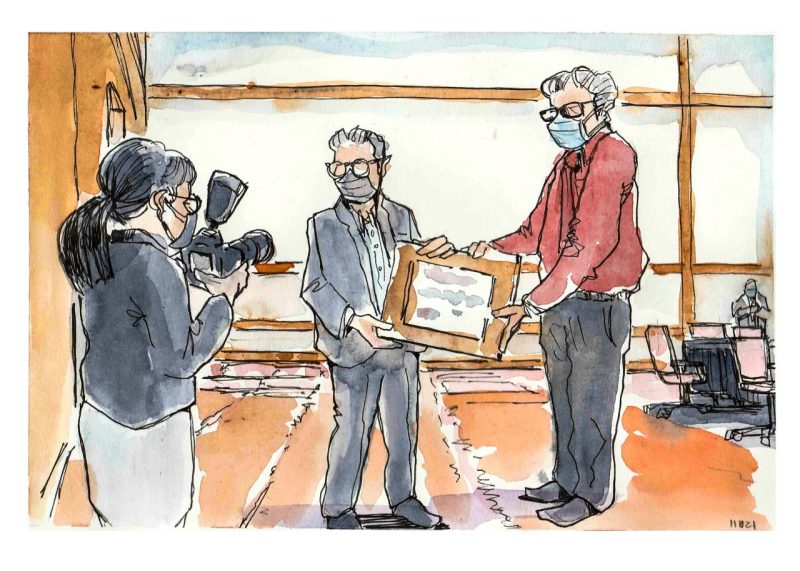 ink and watercolor sketch of President Tim Sands (left) presents a certificate of appreciation to Mike Mulhare, assistant vice president for emergency management