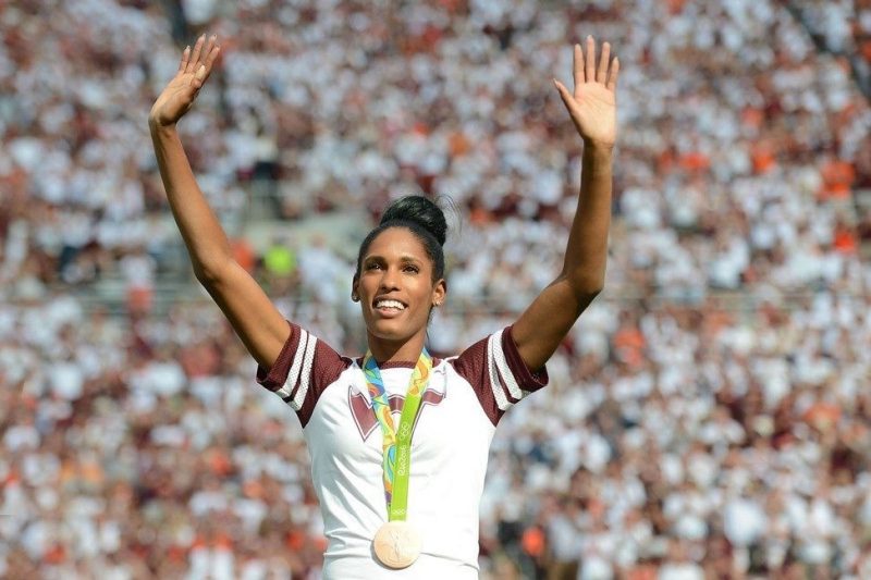 Kristi Castlin on the podium with gold medal at the 2016 Olympics held in Rio de Janeiro, Brazil