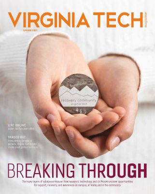 Spring 2021 magazine cover image with a pair of hands holding a token from the recovery community
