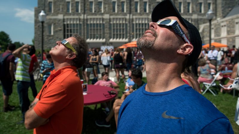 People looking up into sky during eclipse at Virginia Tech