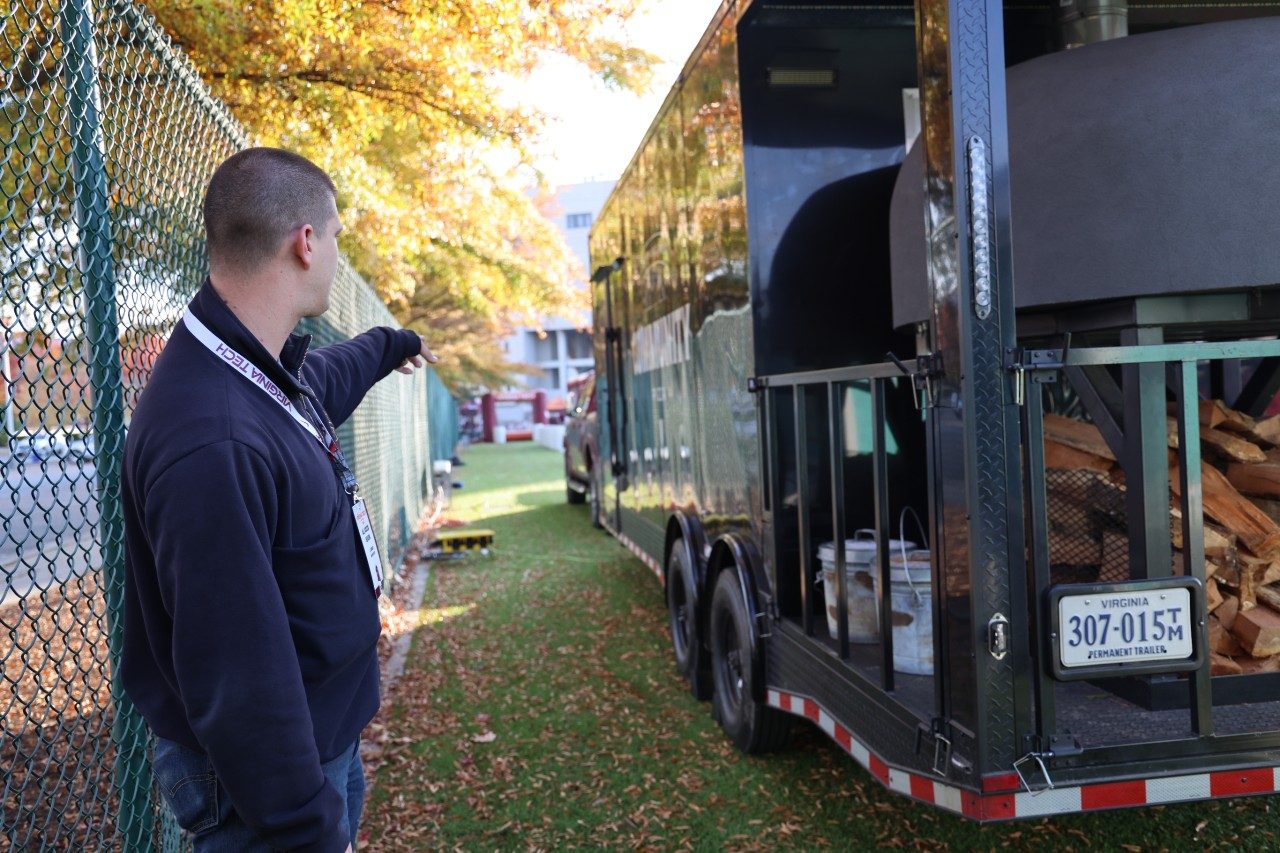 A member of Environmental Health and Safety's Fire Safety Team inspecting tailgate areas.