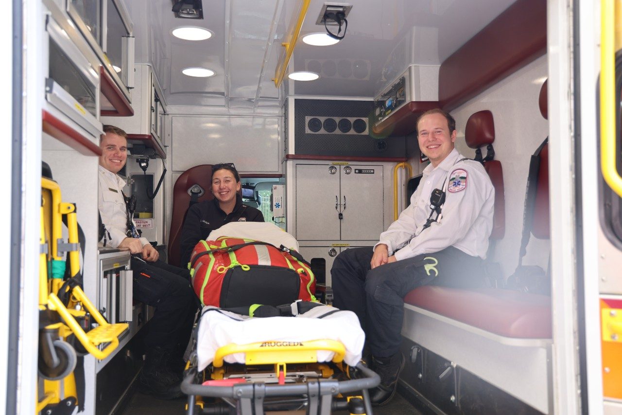 Virginia Tech Rescue Squad members in an ambulance preparing for game day.