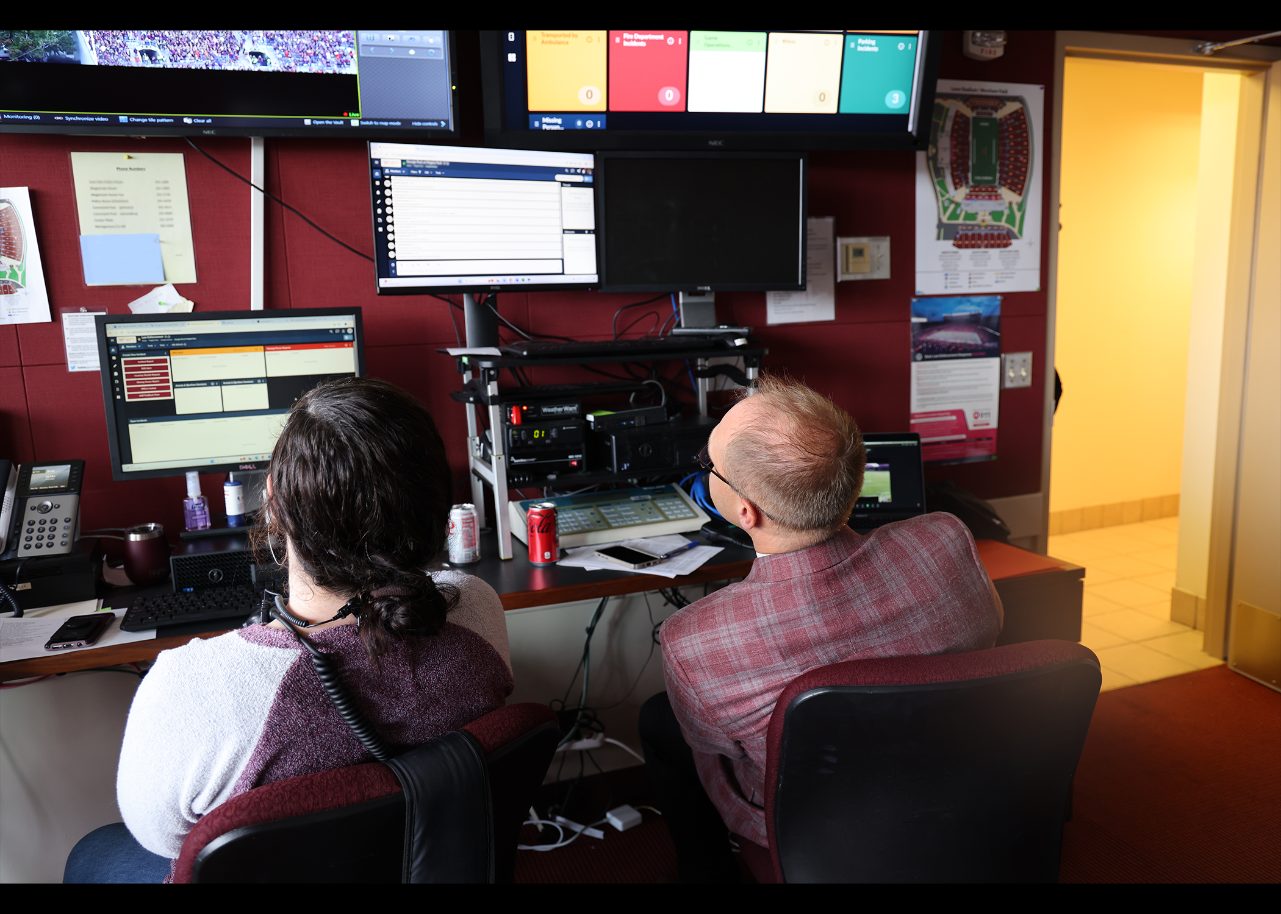 Caroline Newell and Andrew Marinik checking for emergency notifications.