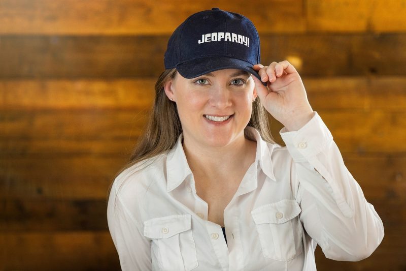 Portrait of Karen Morris in a "Jeopardy" hat.