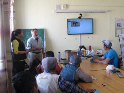 Bruce Bowman trains mongolian herders in a classroom setting.