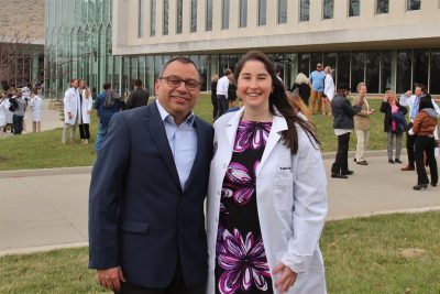 Roger Ramirez-Barrios (at left) with a Class of 2024 student during the class White Coat Ceremony.