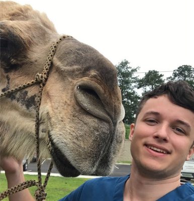 Roberto Steele with a camel.