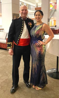 Rebecca Persons (at right) standing next to a man inside