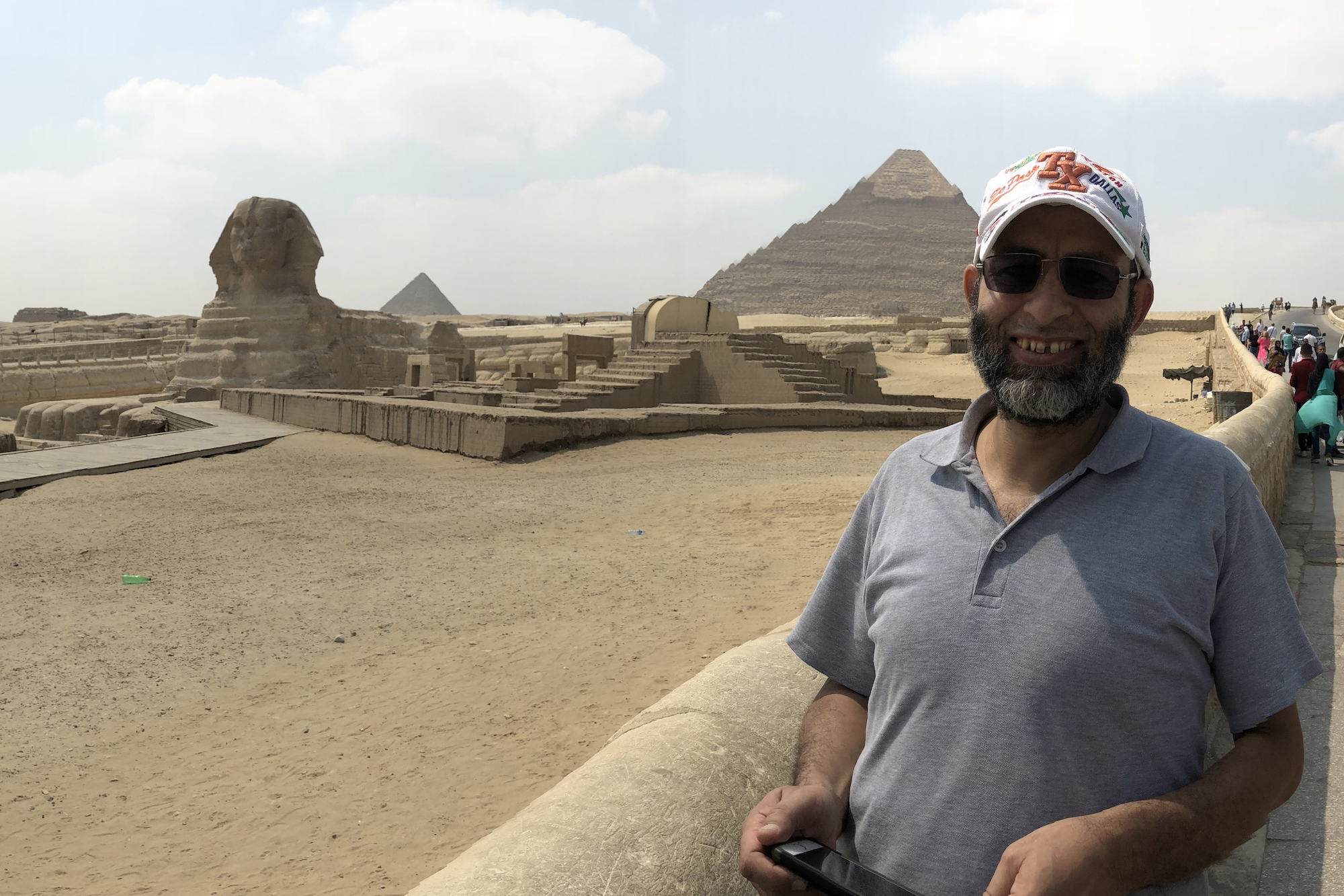 Fawzy Elnady standing in front of the pyramids in Eqypt.