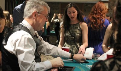 Greg Daniel dealing cards at Casino Night.