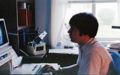 Greg Daniel working at a computer while he was a resident at Illinois.