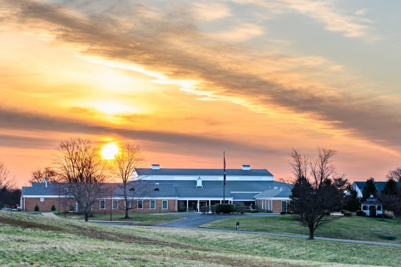 The main building of the Equine Medical Center during sunrise.