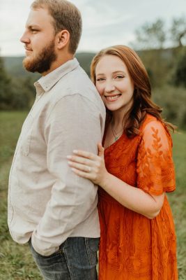 Two people standing outside.