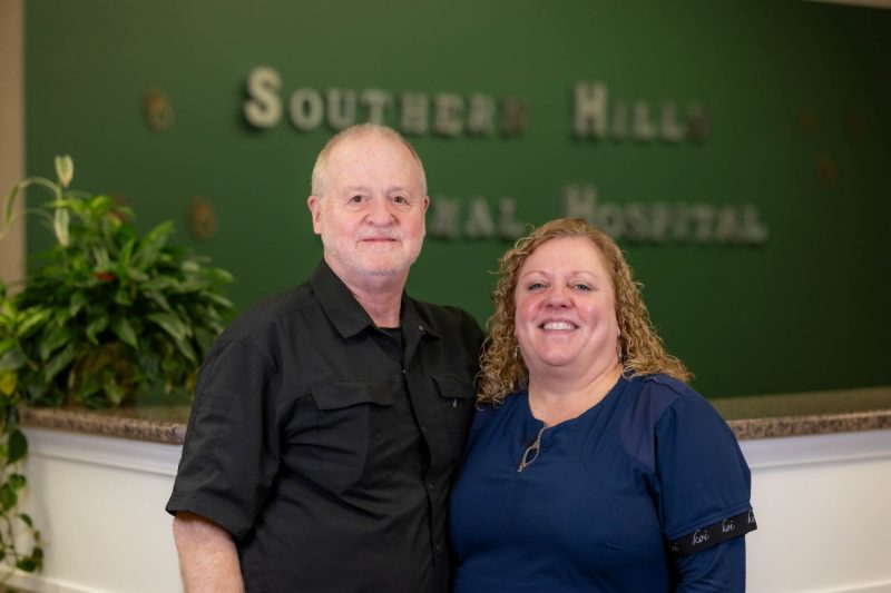 Dr. W Preston Thorton (at left) and Dr. Mary Thorton (at right) posing in the lobby of Southern Hills Animal Hospital