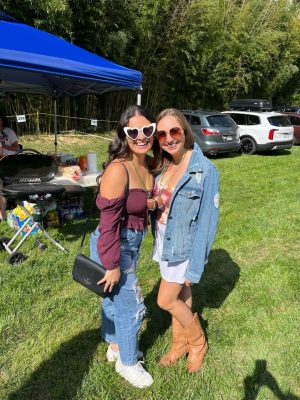 Lauren Maghak (at left) standing outdoors next to a friend (at right)