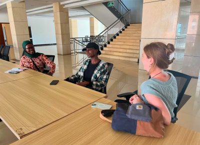 Louhan Dembele speaking with a student at Malawi University of Science and Technology. Pictured: Priscilla Changadeya and Bella Rowland.