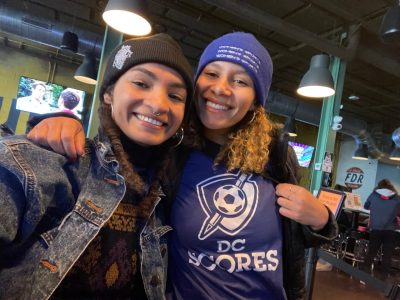 Marissa Vincent (at left) posing with a woman (at right)