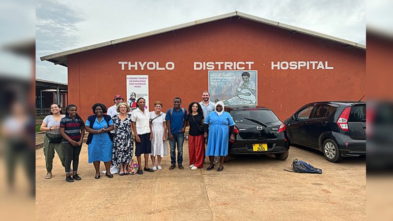 Group posing outside the Thyolo District Hospital in Malawi.