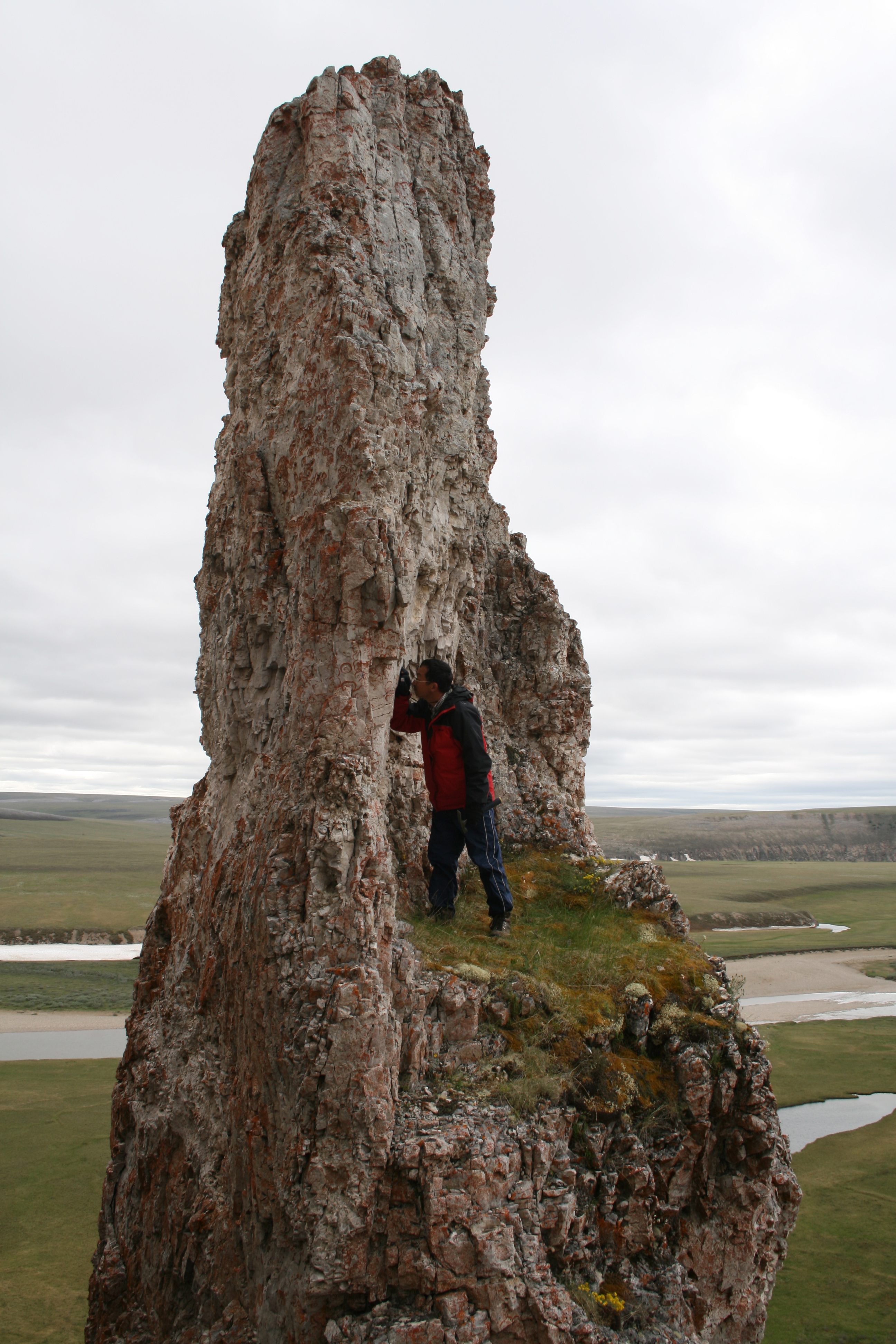 Except for formations such as this dolostone column of the Turkut Formation near the Khorbusonka River, the Siberian Arctic is flat. During his exploration of such formations, Virginia Tech geobiologist Shuhai Xiao and collaborators found many fossils in these ancient rocks. Xiao has received a Guggenheim fellowship to support his research.