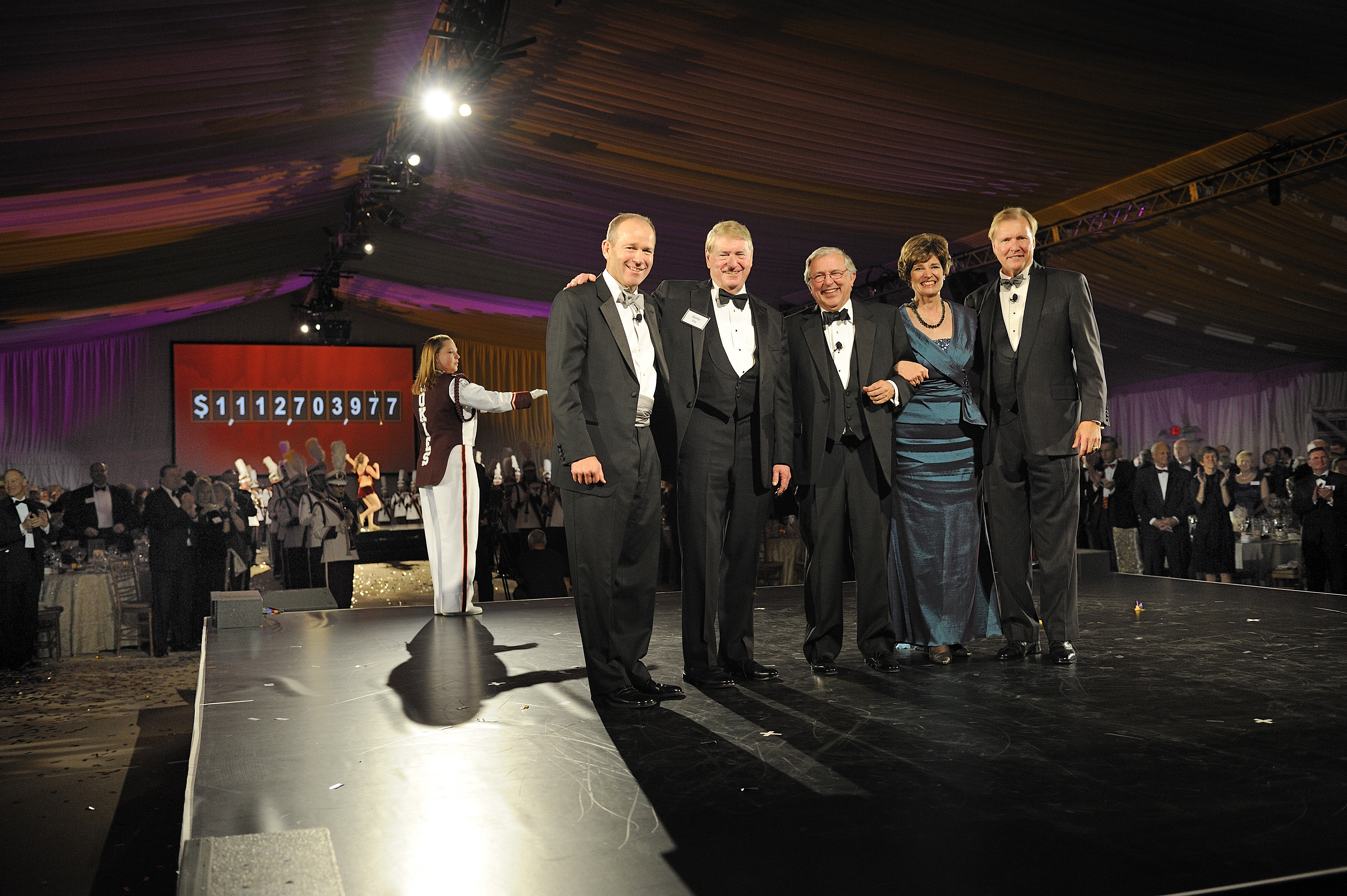 (From left) David Calhoun, Gene Fife, Virginia Tech President Charles W. Steger, Elizabeth Flanagan, and John Lawson appear before the screen that revealed the total amount raised during The Campaign for Virginia Tech: Invent the Future. 